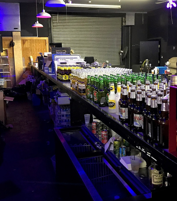 An illegal bar with bottles of beer and liquor 